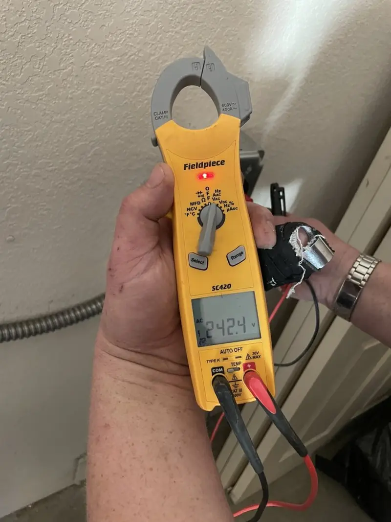 Voltage testing with clamp meter during Generator Installation in St. Johnsbury
